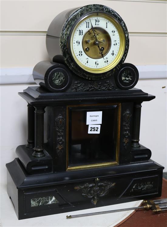 A Victorian black slate and green marble mantel clock height 48cm